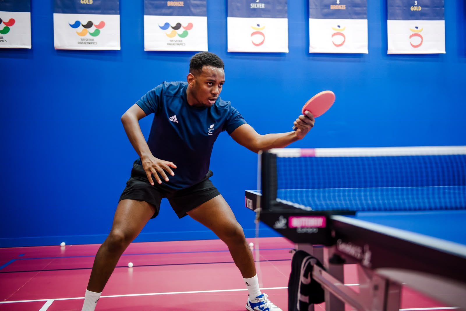 Ashley Facey returning a shot at the GB training base